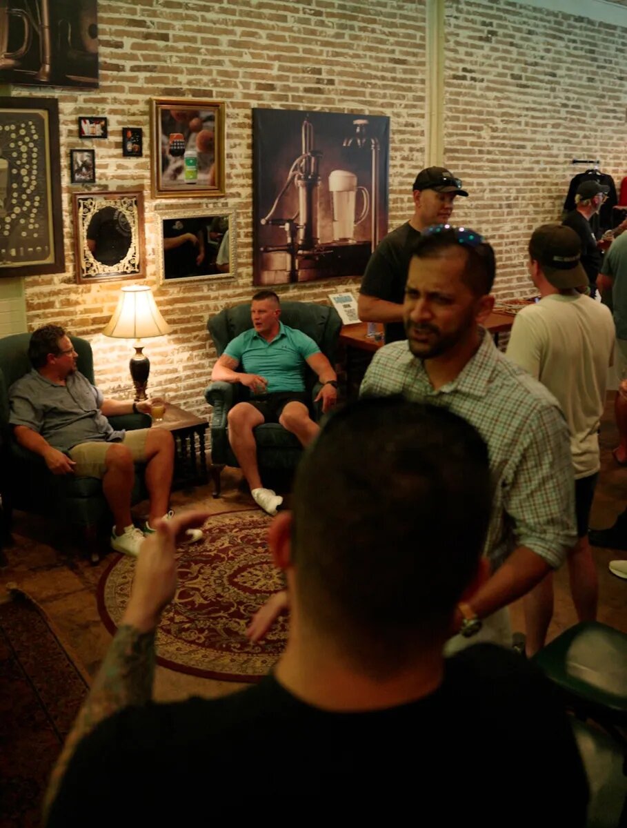 Dads gathering around the seating area at Turning Point Beer