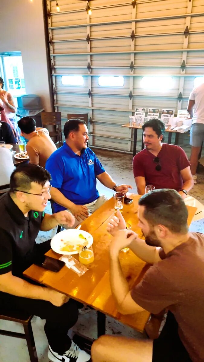 Dads sharing food and conversation at False Idol Brewing