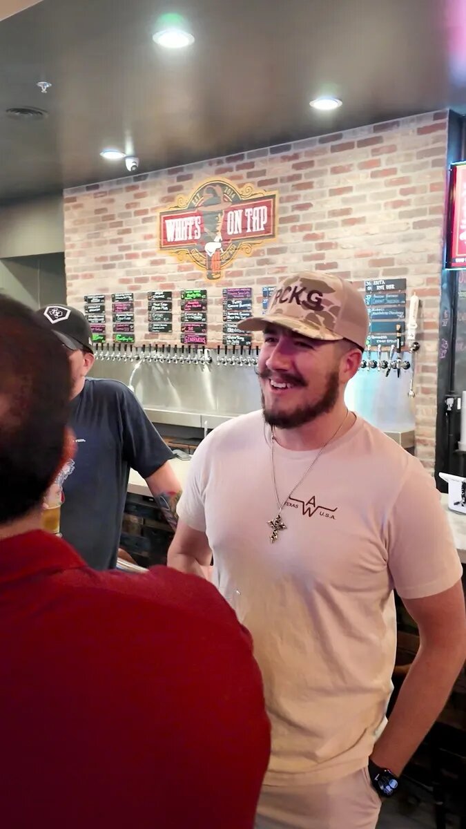 Dads talking beside the taps at What's On Tap